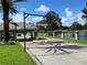 Gated entrance to a community with landscaping and a guardhouse at 3704 Wild Blossom Pl, Parrish, FL 34219