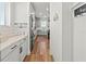 Light and airy hallway leading to the kitchen at 3704 Wild Blossom Pl, Parrish, FL 34219