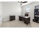 Home office with desk, chair, and built-in shelving at 3704 Wild Blossom Pl, Parrish, FL 34219