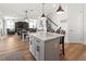 Large kitchen island with seating and white cabinets at 3704 Wild Blossom Pl, Parrish, FL 34219