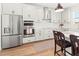 Modern kitchen with stainless steel appliances and white shaker cabinets at 3704 Wild Blossom Pl, Parrish, FL 34219