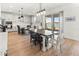 Modern kitchen with white cabinets, a large island, and stainless steel appliances at 3704 Wild Blossom Pl, Parrish, FL 34219