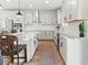 Modern kitchen with white cabinets, quartz countertops, and stainless steel appliances at 3704 Wild Blossom Pl, Parrish, FL 34219