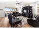 Living room with lake view and leather furniture at 3704 Wild Blossom Pl, Parrish, FL 34219