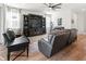 Living room with dark wood furniture and large TV at 3704 Wild Blossom Pl, Parrish, FL 34219