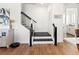 Modern staircase with black railing and white walls at 3704 Wild Blossom Pl, Parrish, FL 34219