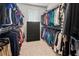 Bright walk-in closet with custom shelving and rod at 3704 Wild Blossom Pl, Parrish, FL 34219