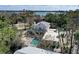 Aerial view of house with pool and waterfront access at 3712 Sandspur Ln, Nokomis, FL 34275