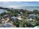 Aerial view showcasing a neighborhood of waterfront homes at 3712 Sandspur Ln, Nokomis, FL 34275