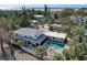 Aerial view of a house with a pool, located near the beach, surrounded by lush greenery at 3712 Sandspur Ln, Nokomis, FL 34275