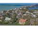Aerial view showcasing waterfront property and homes at 3712 Sandspur Ln, Nokomis, FL 34275
