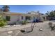 View of backyard and the house's exterior at 3712 Sandspur Ln, Nokomis, FL 34275