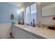 Bright bathroom with double vanity and updated fixtures at 3712 Sandspur Ln, Nokomis, FL 34275