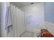 Simple bathroom with a shower, toilet, and white walls at 3712 Sandspur Ln, Nokomis, FL 34275