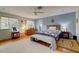 Spacious bedroom with hardwood floors and access to a bathroom at 3712 Sandspur Ln, Nokomis, FL 34275