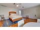 Spacious bedroom with hardwood floors, a ceiling fan, and lots of natural light at 3712 Sandspur Ln, Nokomis, FL 34275