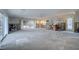 Large bonus room with sliding glass doors and a view of the backyard, under renovation at 3712 Sandspur Ln, Nokomis, FL 34275