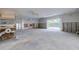 Spacious bonus room with sliding doors and pool view, currently being remodeled at 3712 Sandspur Ln, Nokomis, FL 34275