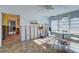 Renovation project: Dining room with tiled floors and a view of the hallway at 3712 Sandspur Ln, Nokomis, FL 34275