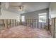 Living room undergoing renovation with tile floors and ceiling fan at 3712 Sandspur Ln, Nokomis, FL 34275