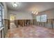 A living room under renovation with terracotta tile floors at 3712 Sandspur Ln, Nokomis, FL 34275