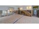 Renovation in progress, showing the living room's layout and staircase at 3712 Sandspur Ln, Nokomis, FL 34275