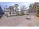 Relaxing pool area with brick patio and tropical landscaping at 3712 Sandspur Ln, Nokomis, FL 34275