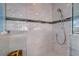 Clean shower with glass enclosure and modern tile at 3712 Sandspur Ln, Nokomis, FL 34275