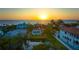 Single-story home with pool, canal views, and ocean in background at 3858 Casey Key, Nokomis, FL 34275