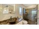 Modern bathroom with walk-in shower, vessel sink, and marble vanity at 3858 Casey Key, Nokomis, FL 34275