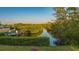 Serene canal view with lush landscaping and private dock at 3858 Casey Key, Nokomis, FL 34275