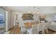 Bright dining room with wood table and white chairs at 3858 Casey Key, Nokomis, FL 34275