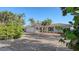 Charming house with a brick driveway and lush landscaping at 3858 Casey Key, Nokomis, FL 34275