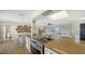 Open kitchen features granite countertops, stainless steel appliances, and breakfast bar at 3858 Casey Key, Nokomis, FL 34275