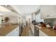 Modern kitchen with granite countertops and stainless steel appliances at 3858 Casey Key, Nokomis, FL 34275