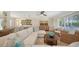 Bright living room with sectional sofa and large windows at 3858 Casey Key, Nokomis, FL 34275