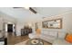 Spacious living room includes a comfortable sectional sofa and large mirror at 3858 Casey Key, Nokomis, FL 34275