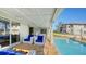 Inviting pool area with patio furniture and covered lanai at 3858 Casey Key, Nokomis, FL 34275