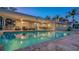 Expansive pool at night with outdoor seating at 3858 Casey Key, Nokomis, FL 34275