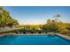 Relaxing pool with tranquil water views and lounge chairs at 3858 Casey Key, Nokomis, FL 34275