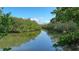 Serene waterway view with lush mangrove trees at 3858 Casey Key, Nokomis, FL 34275