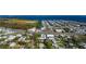 Aerial showing a house and lot near waterway, surrounded by other homes at 4420 102Nd W St, Bradenton, FL 34210