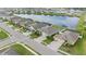 Aerial view of houses and a lake in a residential community at 452 Tierra Verde Way, Bradenton, FL 34212