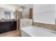 Relaxing bathroom with a soaking tub, shower, and granite countertops at 452 Tierra Verde Way, Bradenton, FL 34212