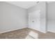 Well-lit bedroom featuring neutral walls, carpeting, and a double door closet at 452 Tierra Verde Way, Bradenton, FL 34212