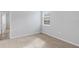 Spacious bedroom with neutral walls and carpeting, and access to another room at 452 Tierra Verde Way, Bradenton, FL 34212