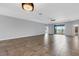 Spacious living room with tile floors and sliding glass doors leading to the backyard at 452 Tierra Verde Way, Bradenton, FL 34212