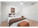 Bright bedroom featuring wood floors and ceiling fan at 4810 Bay Shore Rd, Sarasota, FL 34234