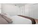 Charming bedroom with light walls, wood floors and closet at 4810 Bay Shore Rd, Sarasota, FL 34234
