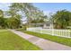 Charming house with white picket fence and manicured lawn at 4810 Bay Shore Rd, Sarasota, FL 34234